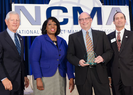 Receiving a Macfarland Writing Competition Award from the National Contracts Management Association